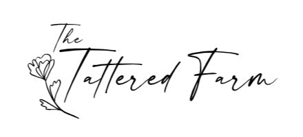 the tattered farm co logo words with outline of flower